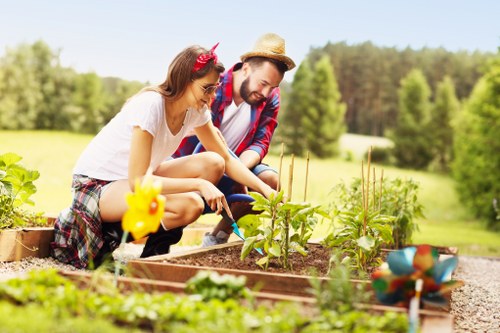 Front view of a gardener assessing a residential garden